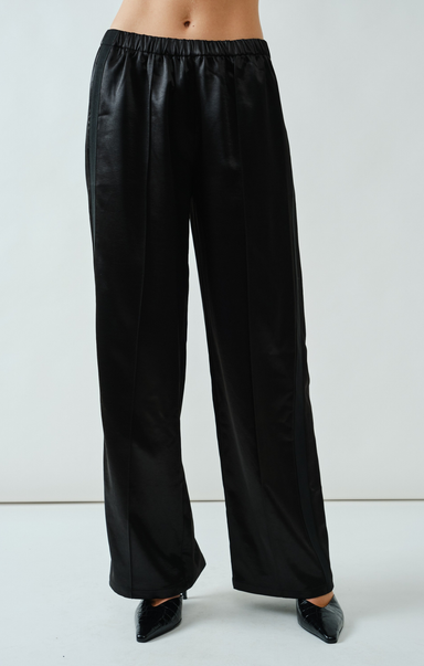 Black wide-leg pants worn by a person on a white background
