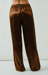 Brown satin pants on a white background
