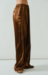 Brown wide-leg pants worn by a person on a white background