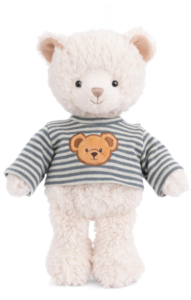White teddy bear wearing a striped sweater with a bear face design on a white background