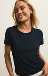 Woman wearing a navy blue t-shirt against a plain background