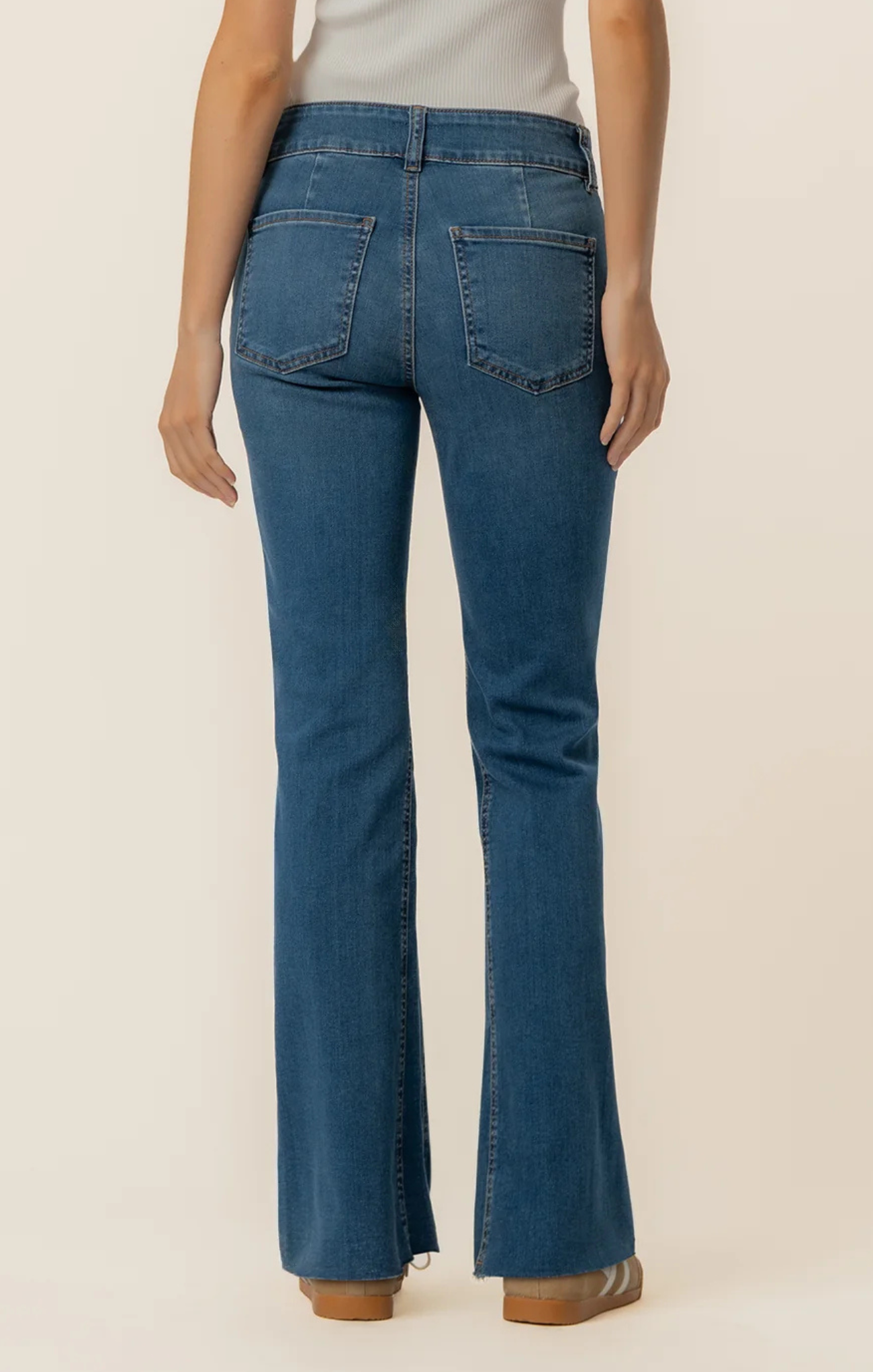 woman in jeans on white background