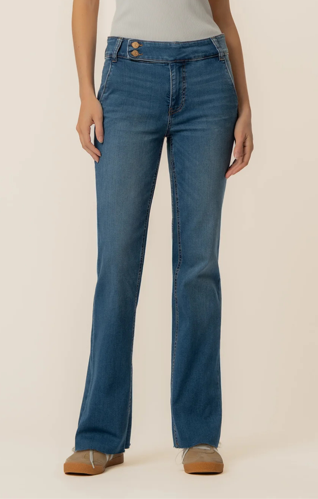 woman in jeans on white background