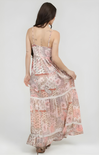 Woman wearing a floral patterned dress on a white background