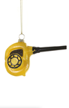 Yellow blow dryer ornament on a white background