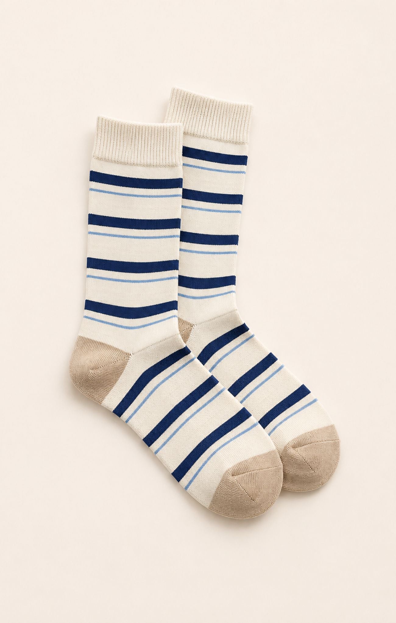 blue and tan socks on neutral background
