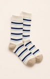 blue and tan socks on neutral background