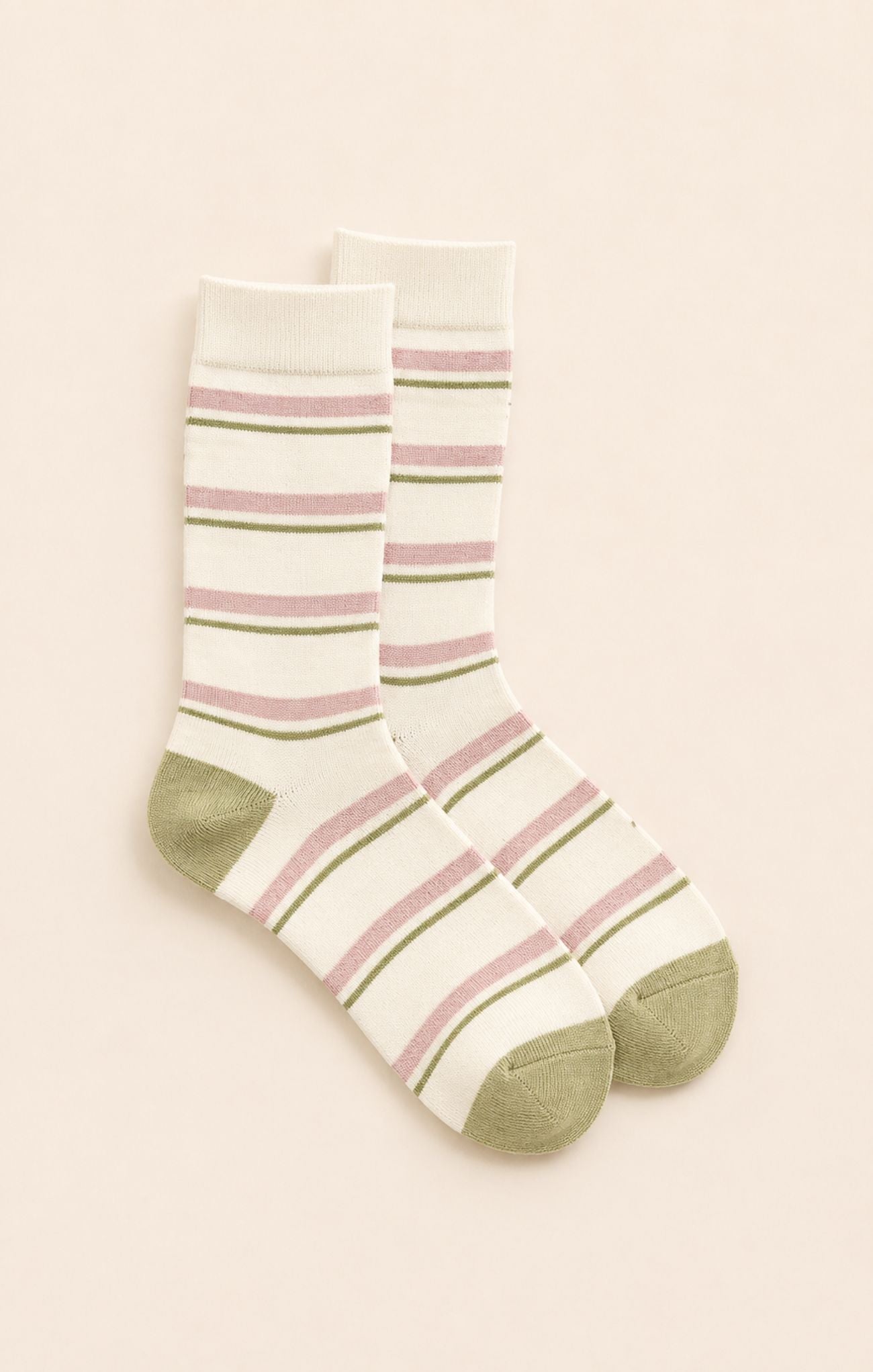 pink and green socks on neutral background