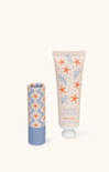 Hand lotion and lip balm with starfish design on a white background