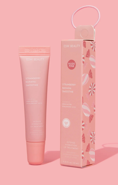 Pink skincare product with packaging on a pink background