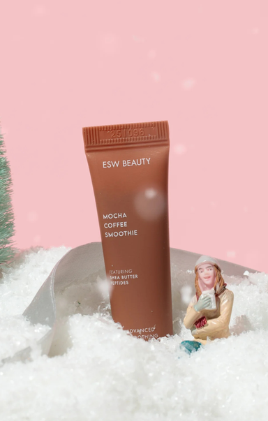 ESW Beauty Mocha Coffee Smoothie product in a snowy scene with a pink background