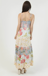 Woman wearing a floral dress with a white background