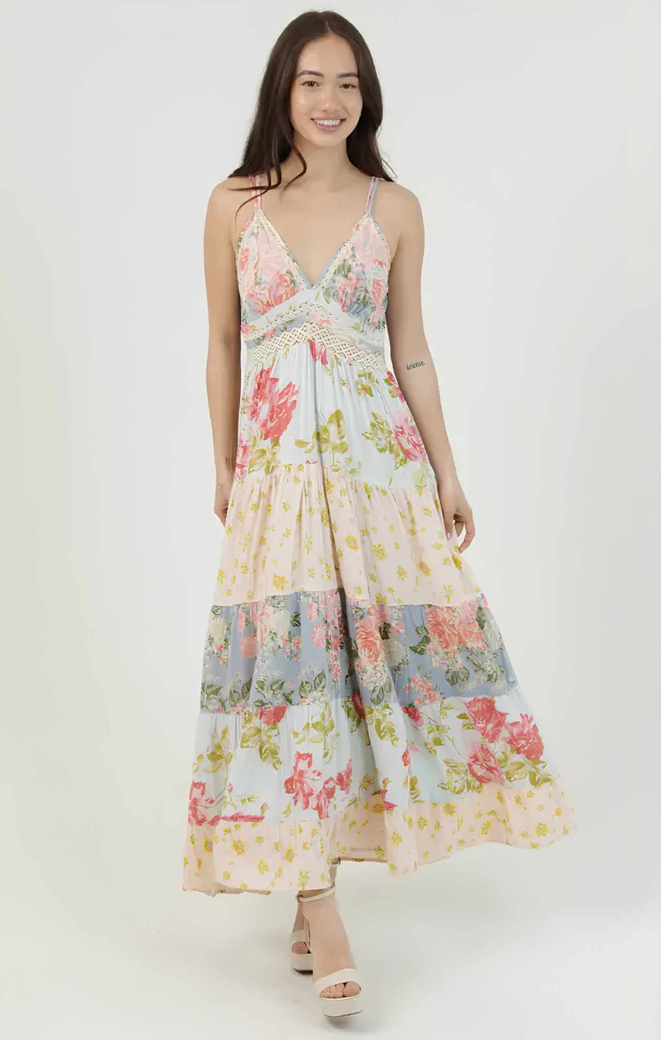 Woman wearing a floral dress on a white background