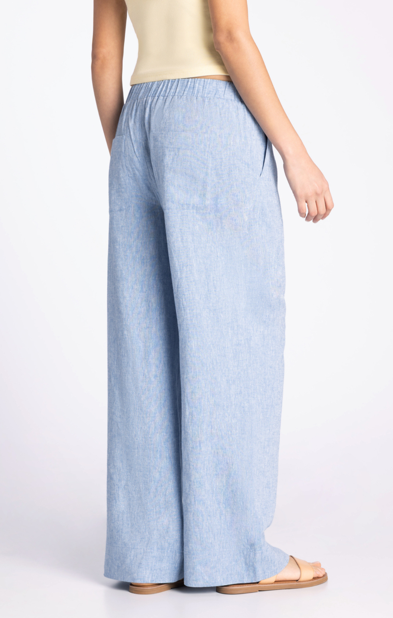 Light blue wide-leg pants worn by a person on a white background