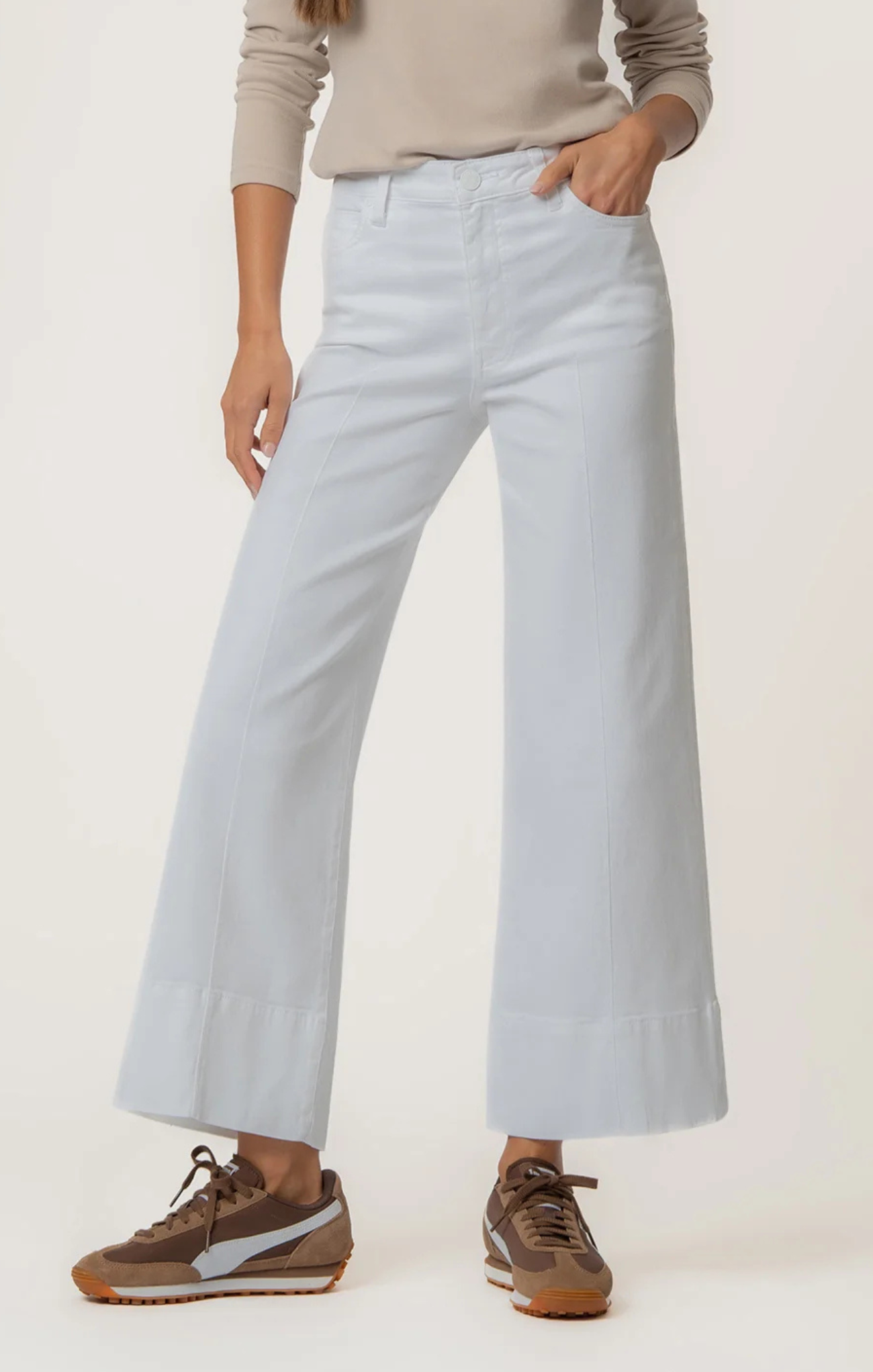 Light blue wide-leg pants worn by a person on a white background