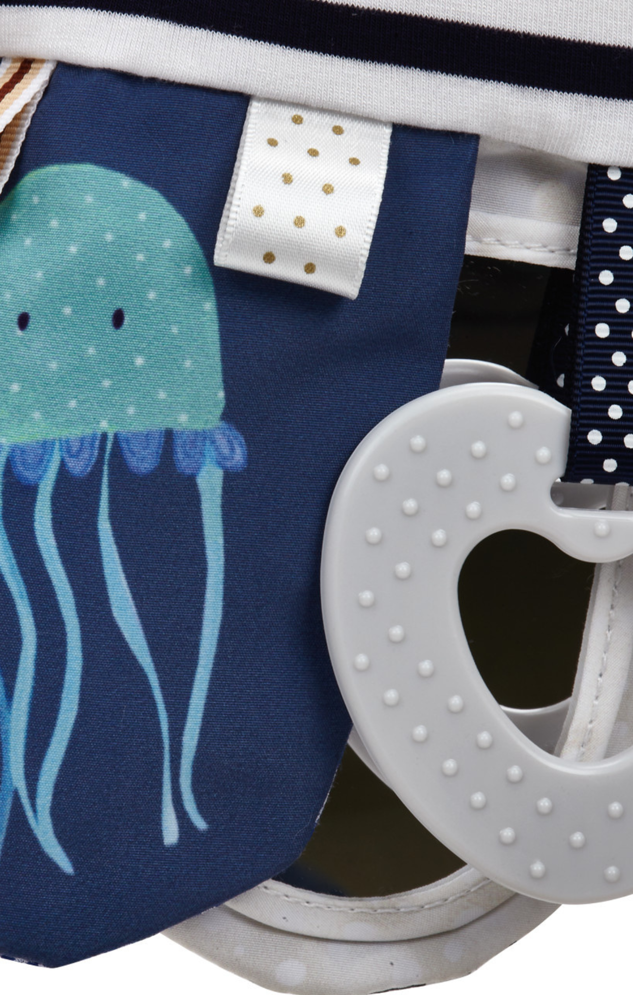 Navy bag with jellyfish design and white heart-shaped object on a white background