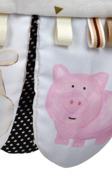 Fabric with a pink pig design and various ribbons on a white background