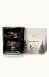 Thymes Noir Woods candle packaging on a white background