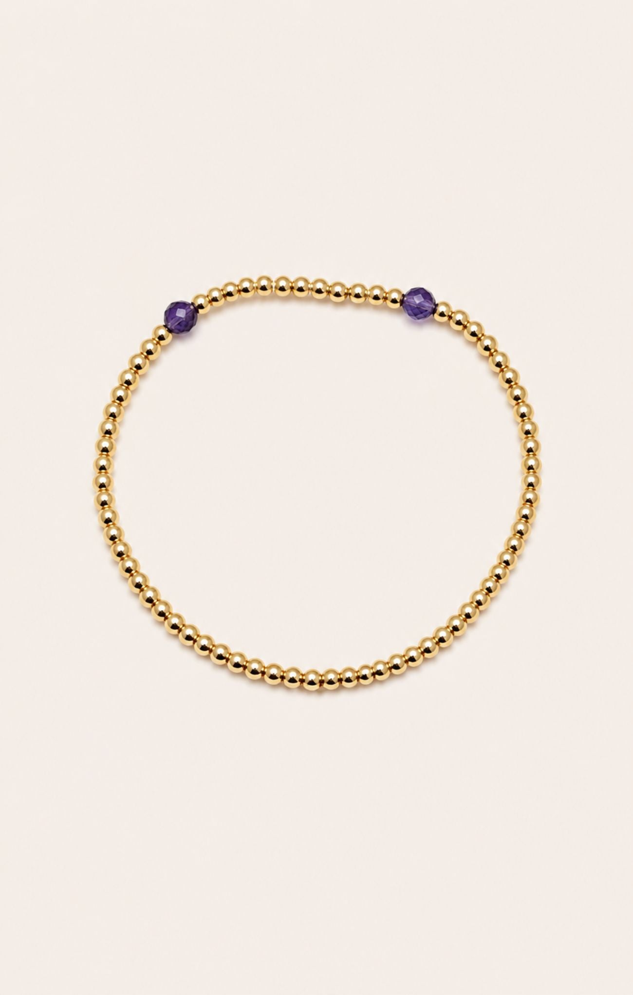 gold bracelet on neutral background