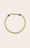 gold bracelet on neutral background