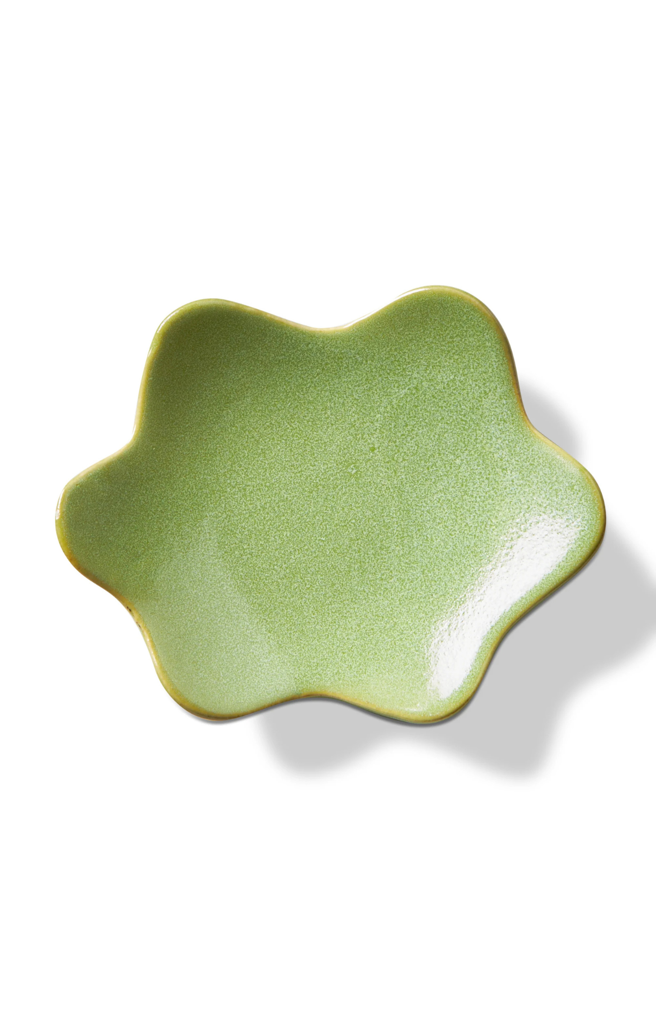 Green ceramic dish on a white background