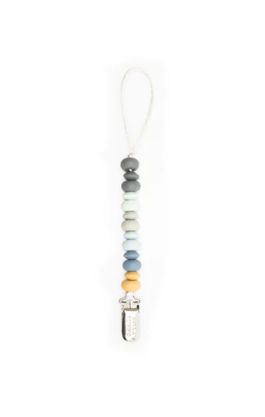 grey blue and yellow beaded pacifier clip on white background