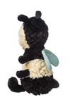 Plush toy resembling a bee with black, white, and green colors on a white background