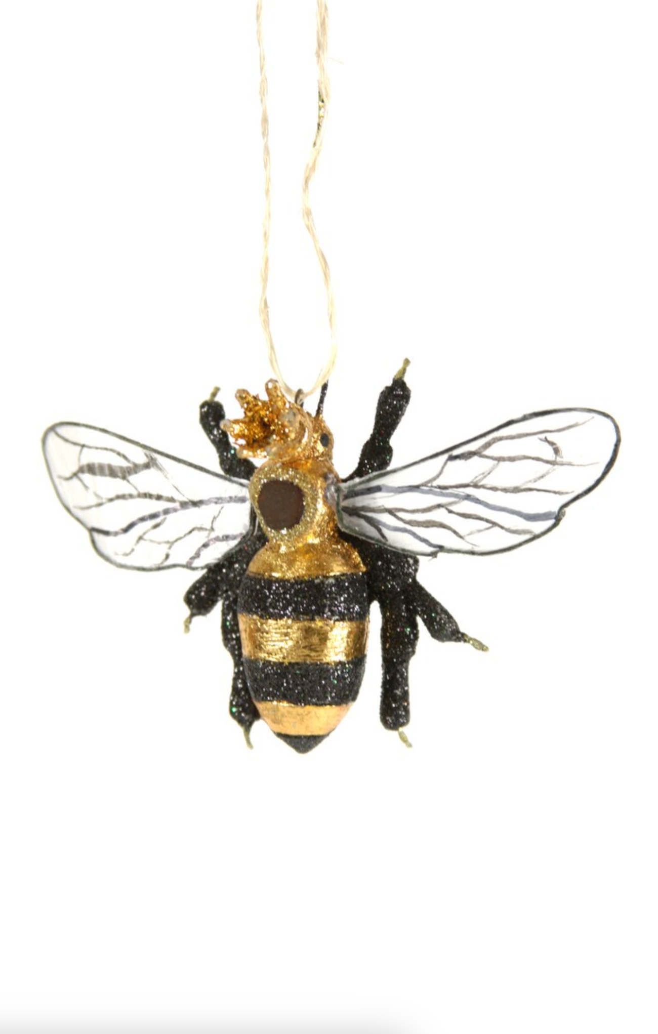 Decorative bee ornament with gold and black details on a white background