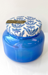 Blue jar with a patterned lid on a white background