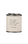 Candle with a quote by Yogi Bhajan on a white background
