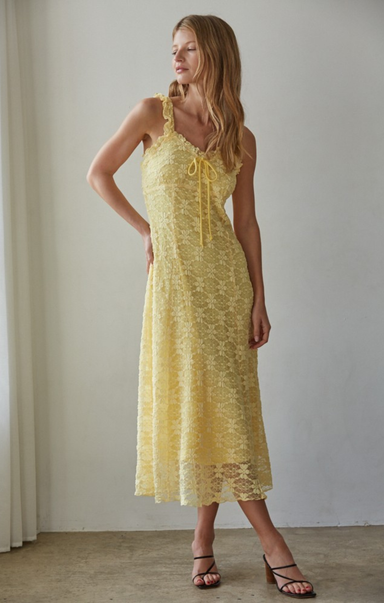 women in yellow midi dress on beige background