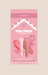 Pink packaging of ESW Beauty Pink Sugar Nourished Lips with lip balm and applicator on a beige background