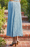 woman wearing blue skirt on stairs