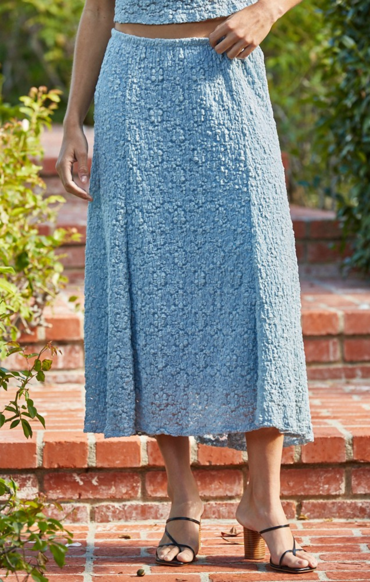 woman wearing blue skirt on stairs