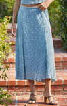 woman wearing blue skirt on stairs