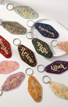 Set of zodiac-themed keychains on a white background