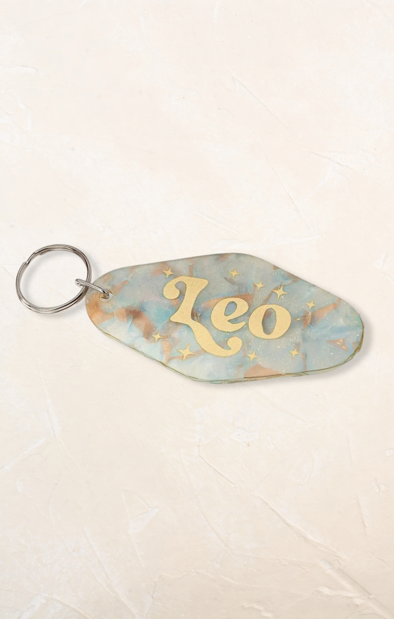 Keychain with 'Leo' and star design on a light background