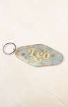 Keychain with 'Leo' and star design on a light background