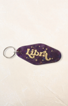Keychain with 'Libra' text on a purple background