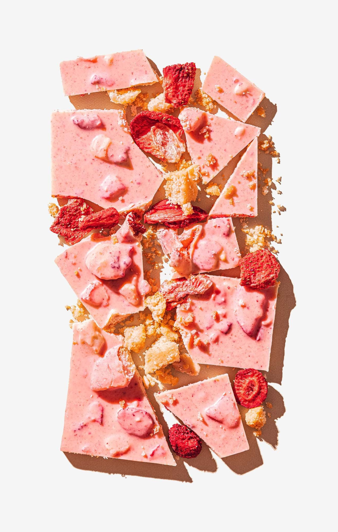 Pink fudge with raspberries on a white background