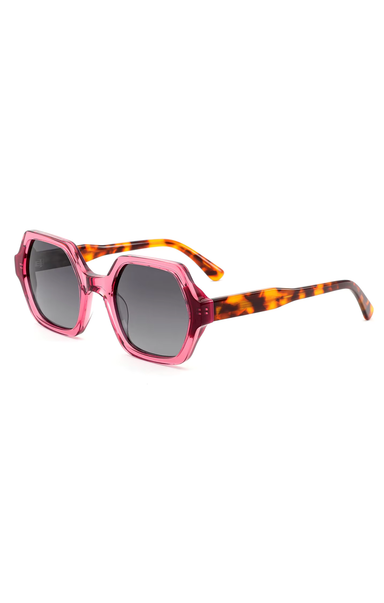 Sunglasses with pink frame and tortoiseshell accents on a white background