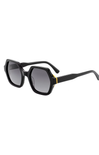 Black sunglasses with a gold accent on a white background