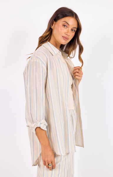 Woman wearing a striped shirt on a white background