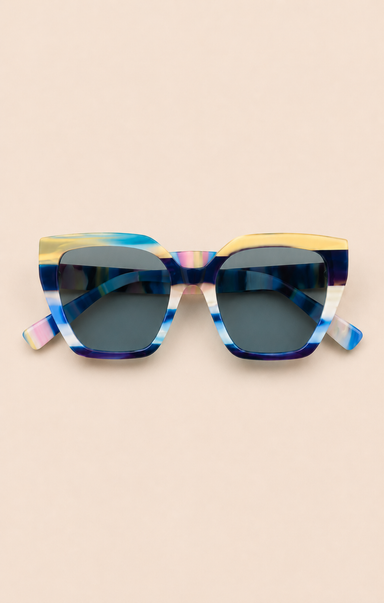 Sunglasses with a colorful frame on a beige background