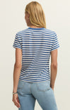 Person wearing a blue and white striped t-shirt and light blue jeans on a plain background
