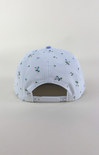 Light blue and white two-tone baseball cap with a solid light blue brim and a white crown featuring a delicate scattered floral print in blue and green.