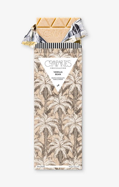 Chocolate bar with a palm tree patterned wrapper on a white background