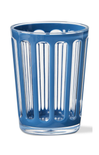 Blue glass tumbler with vertical stripes on a white background