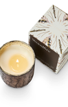 Wood-fired candle in a decorative container with a matching box on a white background