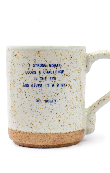 Speckled mug with blue text on a white background